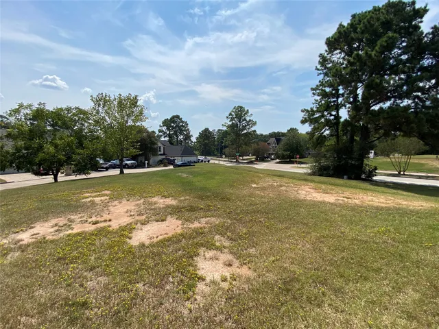 a view of a swimming pool with an outdoor seating and a yard