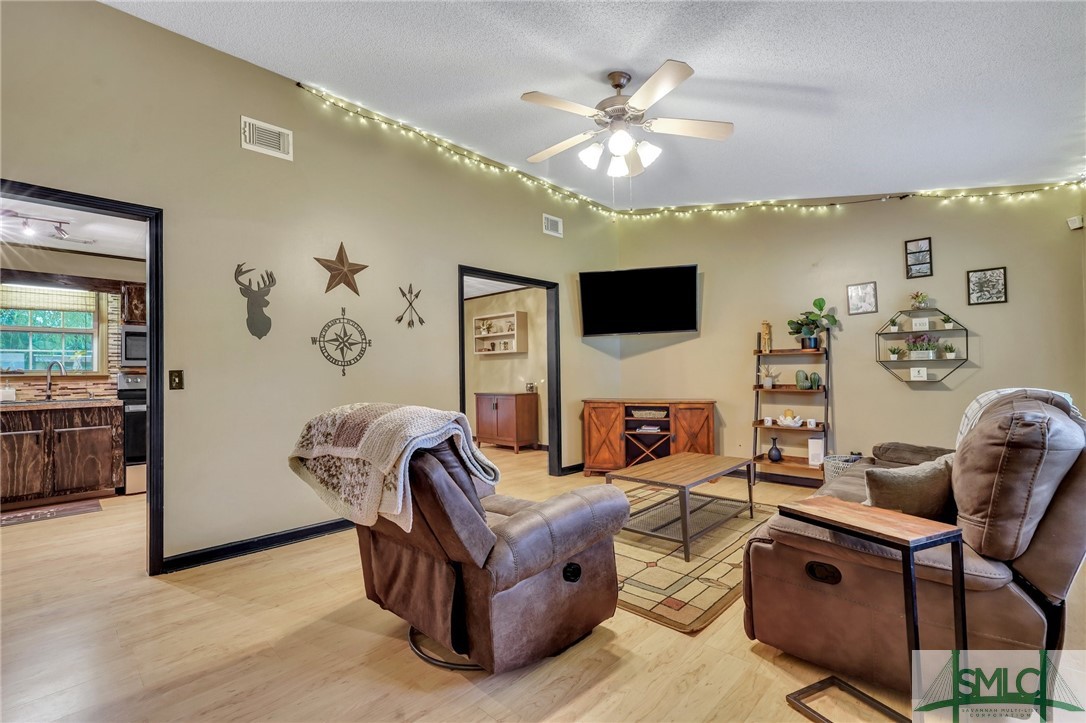 303 Plantation Drive Rincon, GA 31326 - Photo 7 of 28 Tall ceilings and plenty of space in the living ro