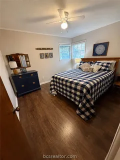 a bedroom with a bed and window