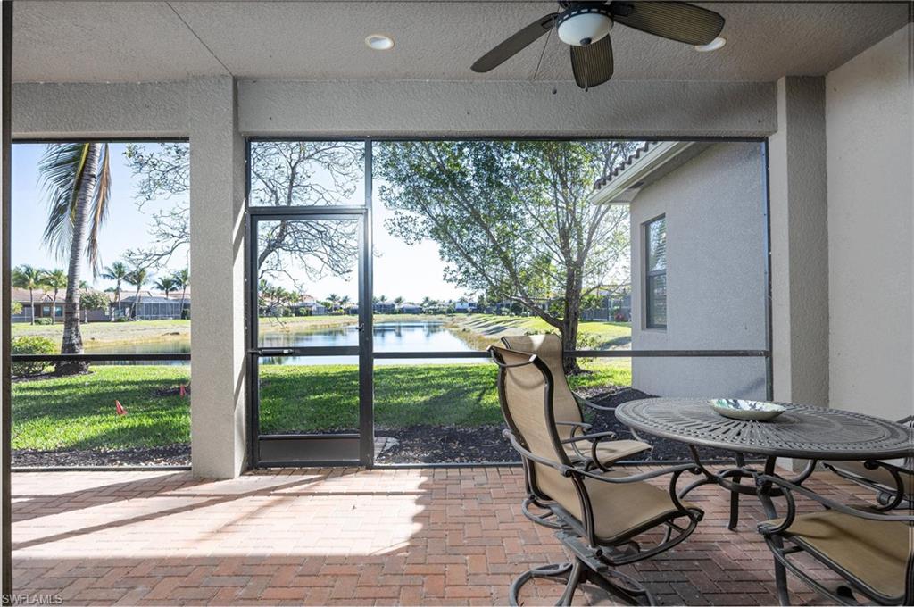 3296 Pacific Drive Naples, FL 34119 - Photo 10 of 50 a view of a dining room with furniture window and outside view