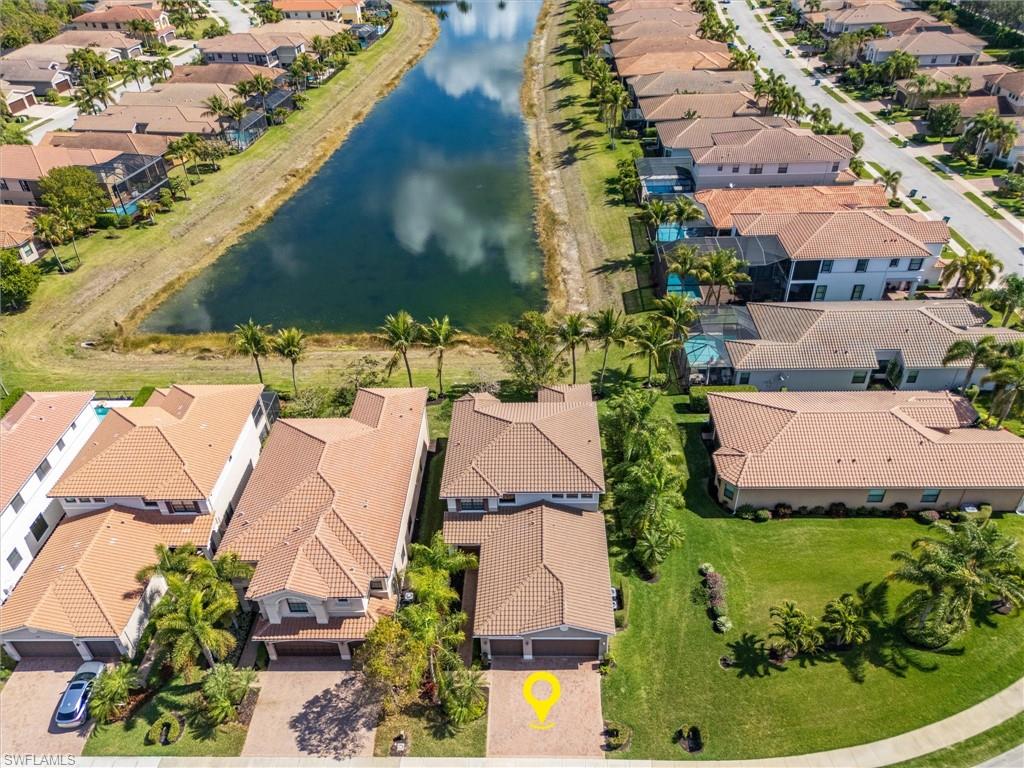3296 Pacific Drive Naples, FL 34119 - Photo 2 of 50 an aerial view of a house with garden space and street view