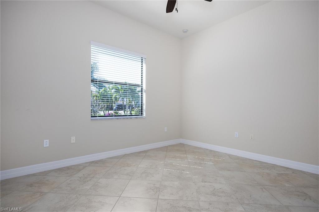 3296 Pacific Drive Naples, FL 34119 - Photo 20 of 50 an empty room with a window