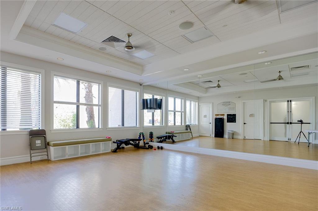 3296 Pacific Drive Naples, FL 34119 - Photo 37 of 50 a large room with pool table and windows