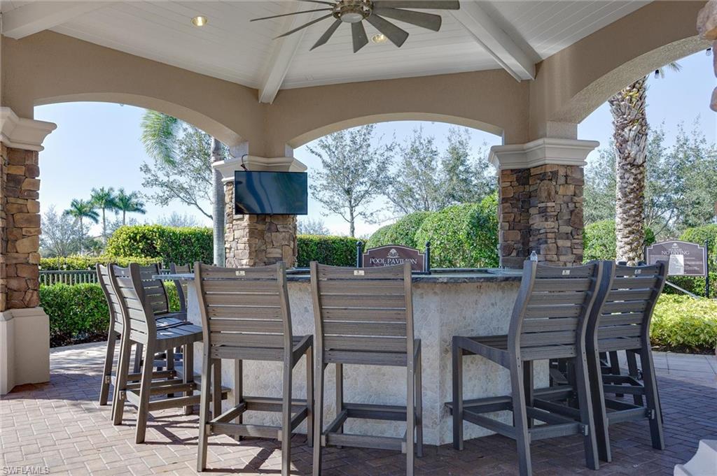 3296 Pacific Drive Naples, FL 34119 - Photo 43 of 50 a view of an outdoor seating area