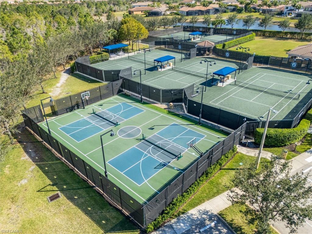 3296 Pacific Drive Naples, FL 34119 - Photo 45 of 50 a view of a tennis ground with furniture