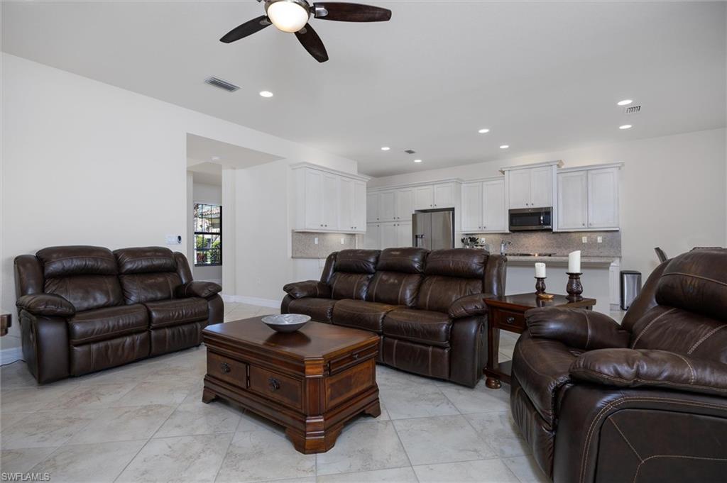 3296 Pacific Drive Naples, FL 34119 - Photo 8 of 50 a living room with furniture