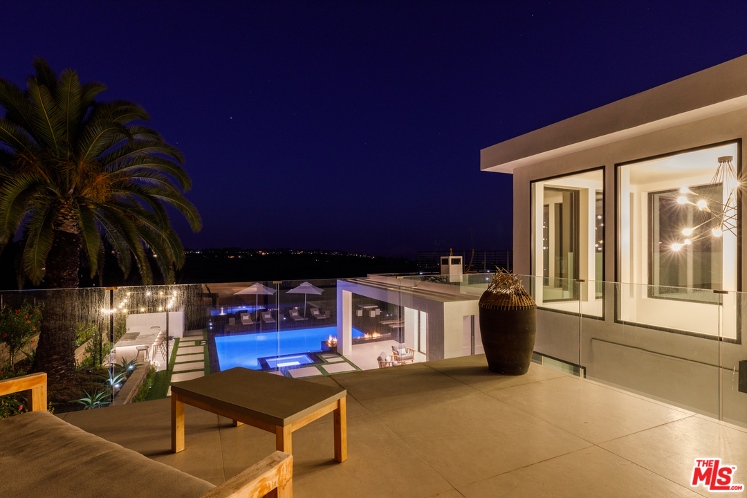 5944 Filaree Heights Road Malibu, CA 90265 - Photo 15 of 33 a view of living room kitchen with stainless steel appliances