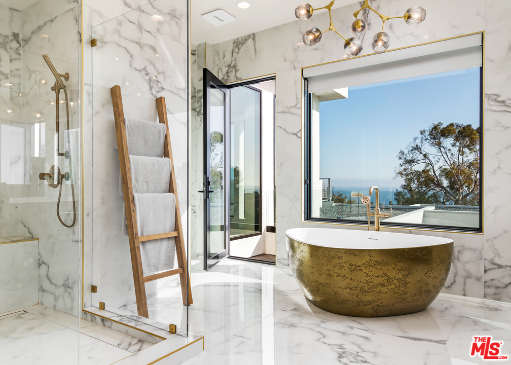 5944 Filaree Heights Road Malibu, CA 90265 - Photo 16 of 33 a room with table and chairs