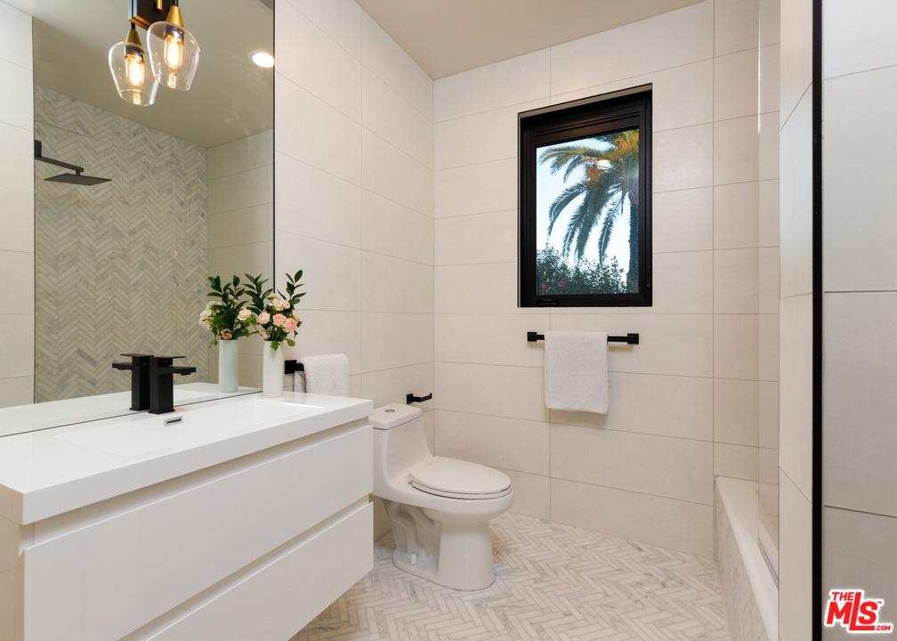 5944 Filaree Heights Road Malibu, CA 90265 - Photo 21 of 33 a bathroom with a toilet sink and mirror