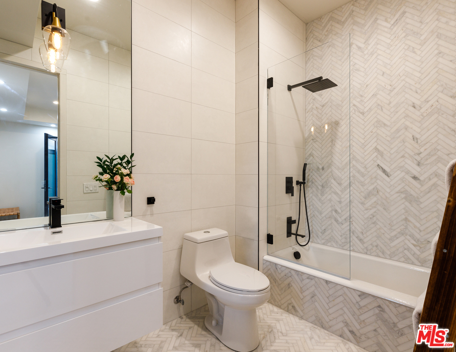 5944 Filaree Heights Road Malibu, CA 90265 - Photo 23 of 33 a bathroom with a sink toilet and shower