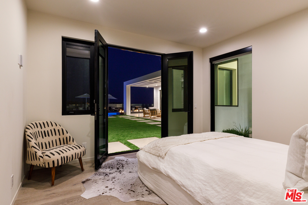 5944 Filaree Heights Road Malibu, CA 90265 - Photo 24 of 33 a bedroom with a bed and a window