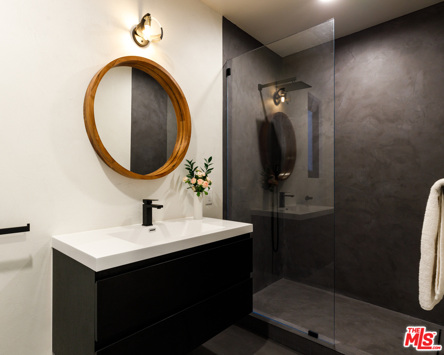 5944 Filaree Heights Road Malibu, CA 90265 - Photo 25 of 33 a bathroom with a sink and a mirror