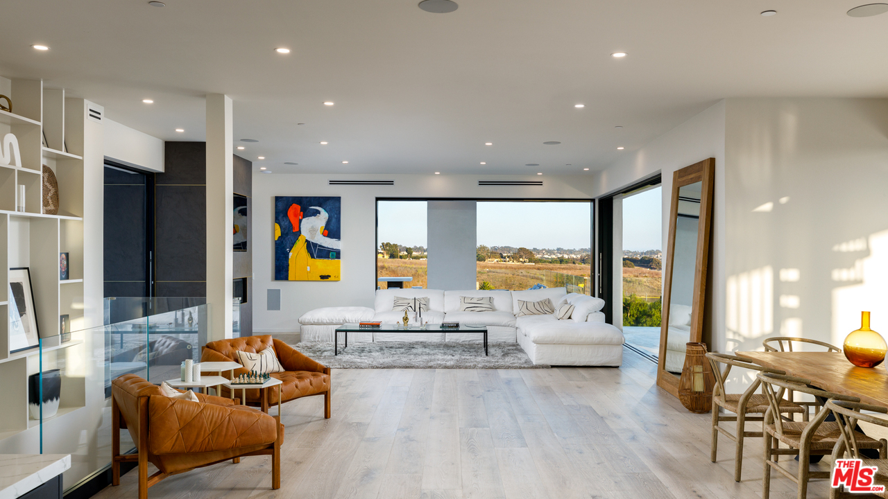 5944 Filaree Heights Road Malibu, CA 90265 - Photo 7 of 33 a living room with furniture and a large window