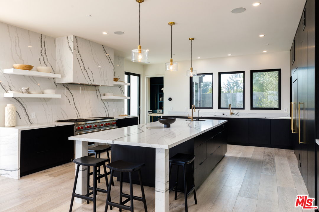 5944 Filaree Heights Road Malibu, CA 90265 - Photo 10 of 33 a large kitchen with a table and chairs