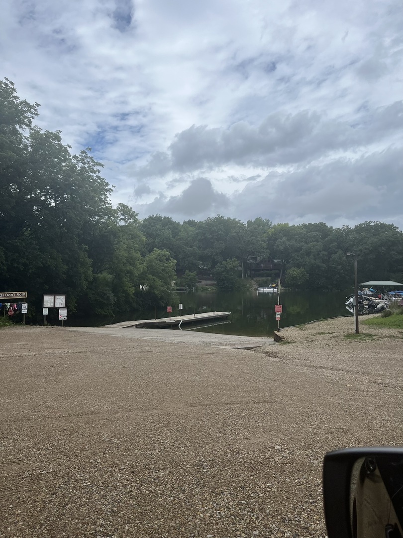 28 Cedar Lane Putnam, IL 61560 - Photo 7 of 9 a backyard of a house with table and chairs