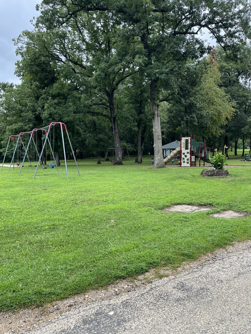 28 Cedar Lane Putnam, IL 61560 - Photo 9 of 9 a backyard of a house with entertaining space