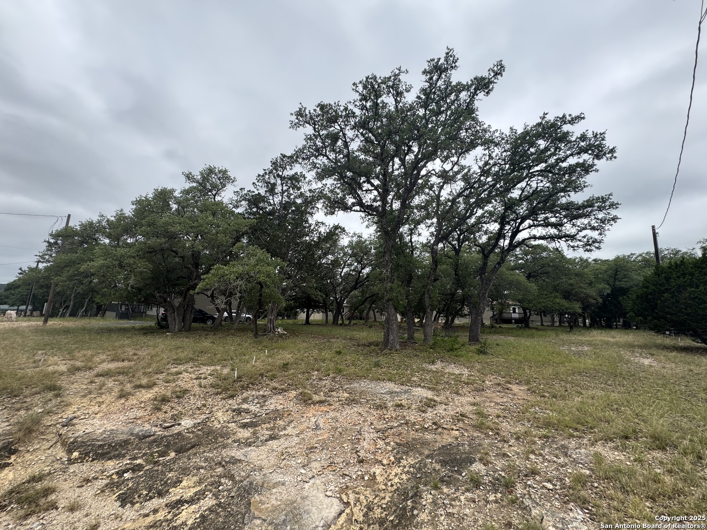 1508 Bandera Bandera, TX 78003 - Photo 7 of 8 a view of a field with trees in the background