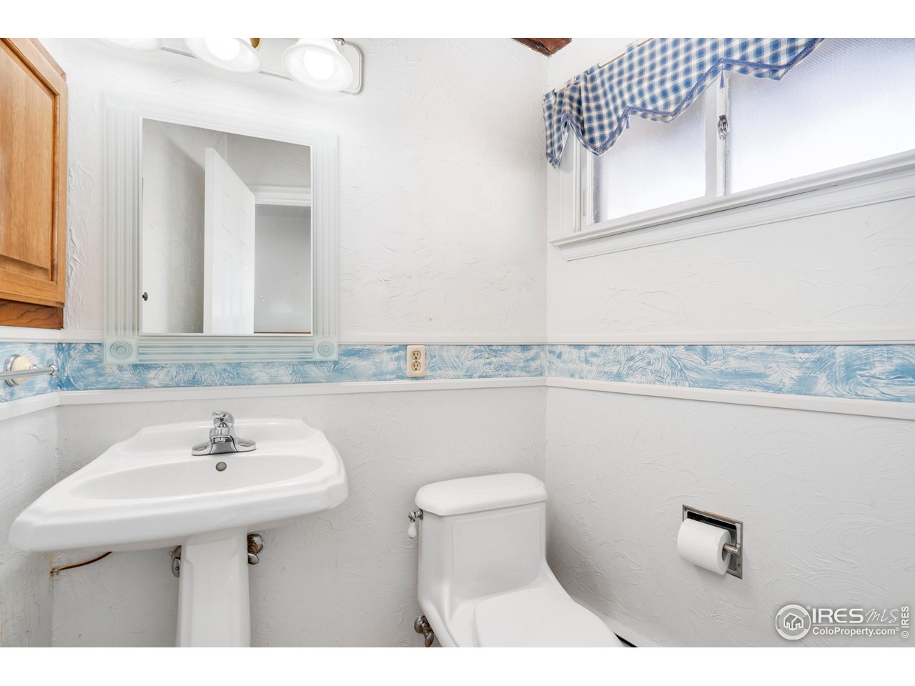 2115 Lindenmeier Road Fort Collins, CO 80524 - Photo 15 of 28 a bathroom with a sink and a mirror