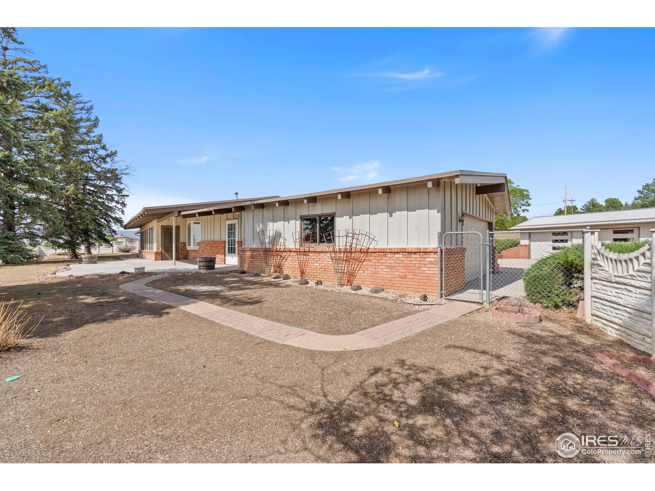 2115 Lindenmeier Road Fort Collins, CO 80524 - Photo 2 of 28 a view of a house with a patio