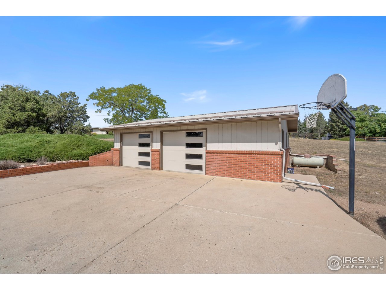 2115 Lindenmeier Road Fort Collins, CO 80524 - Photo 26 of 28 a front view of a house with garden