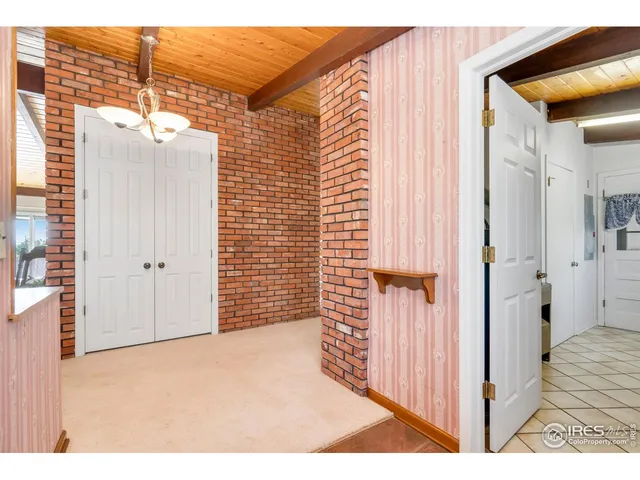 a view of a livingroom with furniture and window