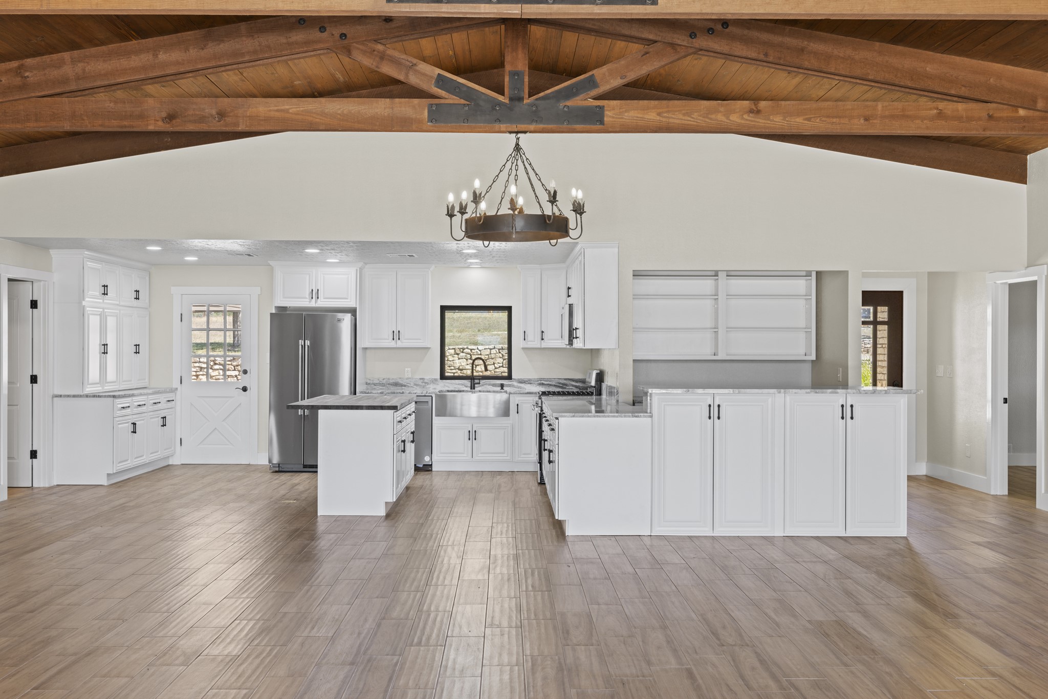 241 Highway 87 Comfort, TX 78013 - Photo 15 of 39 a view of a kitchen with furniture and wooden floor