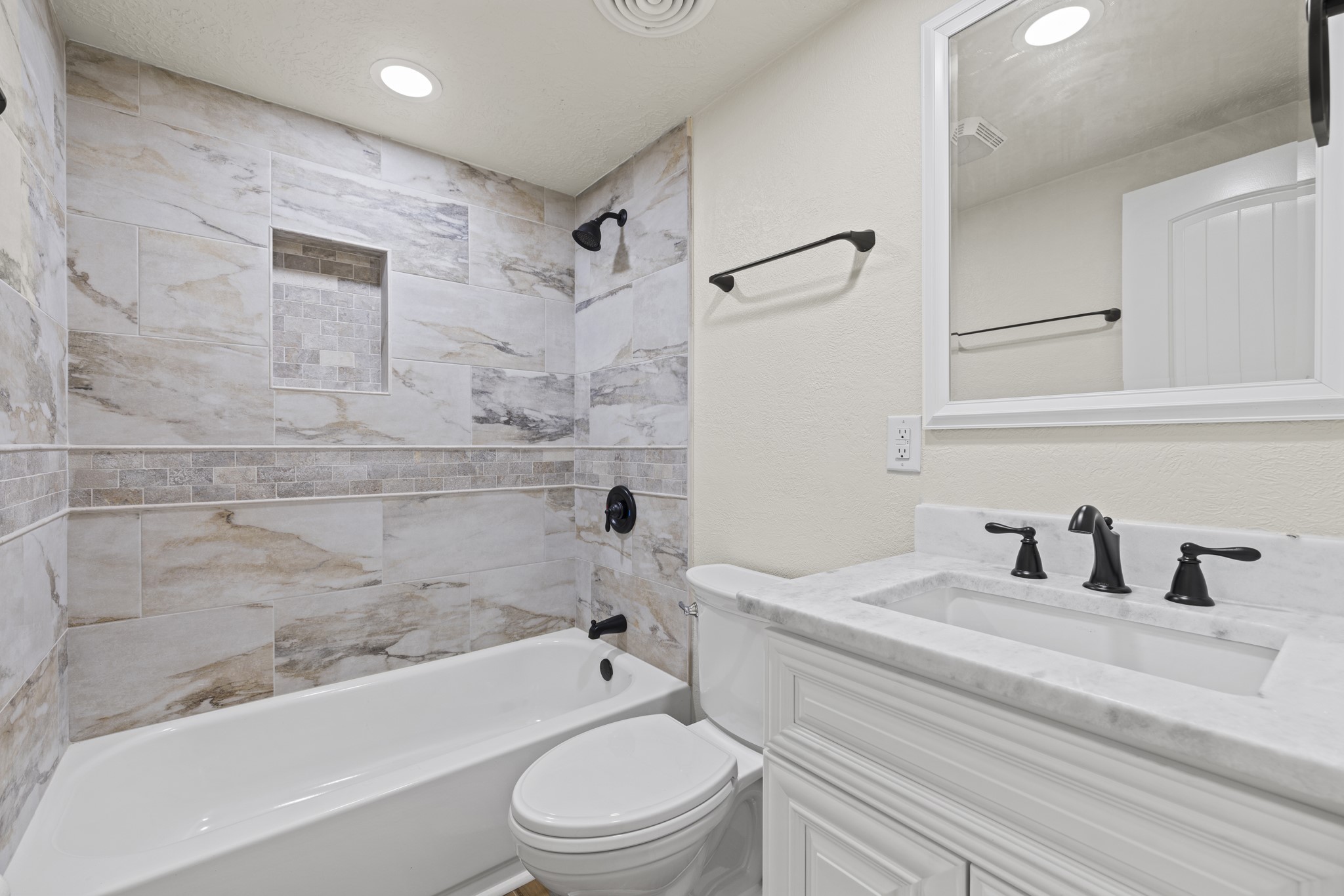 241 Highway 87 Comfort, TX 78013 - Photo 19 of 40 a bathroom with a bathtub shower sink vanity mirror and toilet