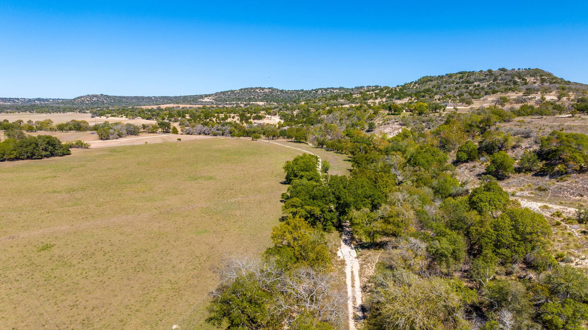 241 Highway 87 Comfort, TX 78013 - Photo 3 of 39 Overview of rural landscape with a mountain backdrop