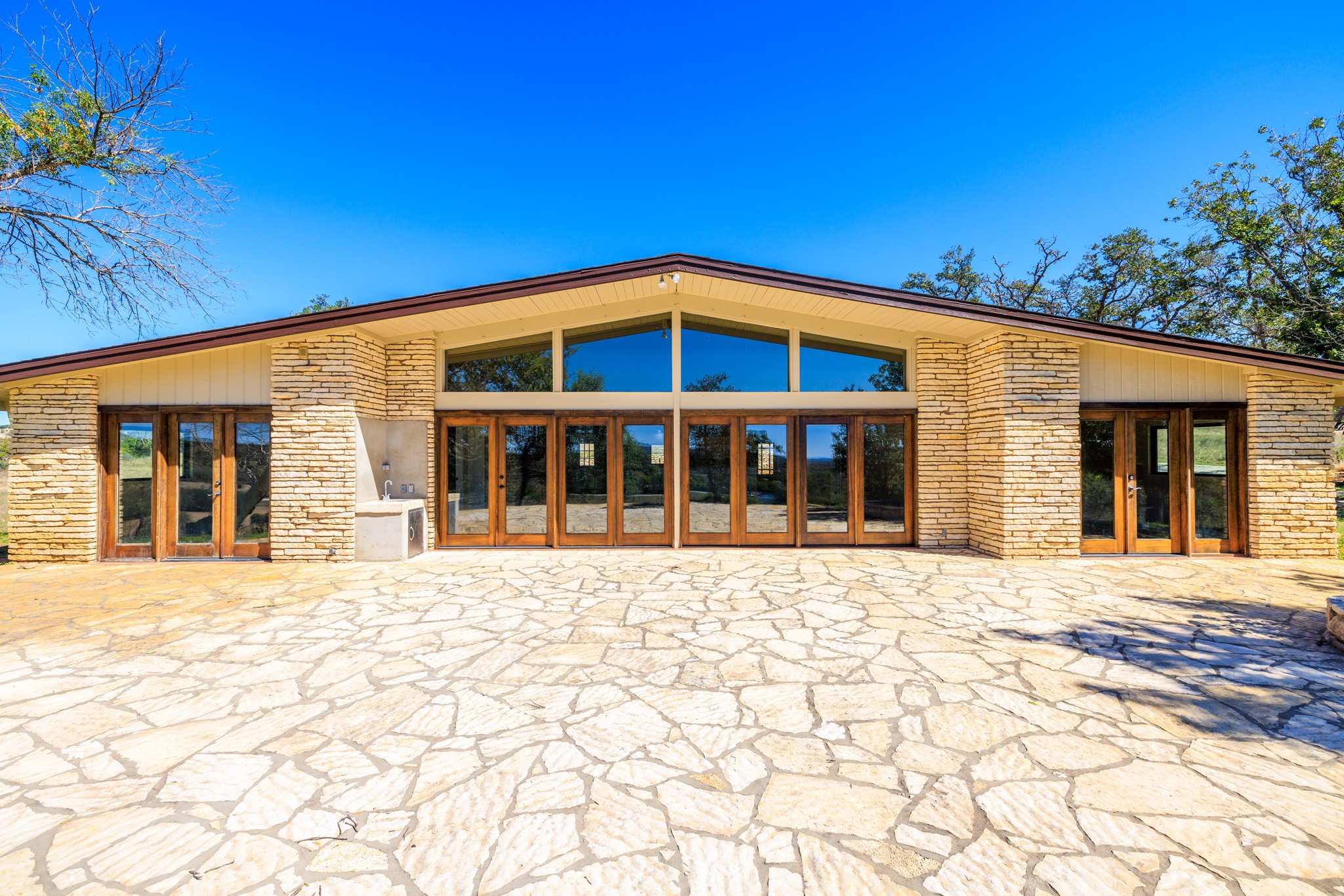 241 Highway 87 Comfort, TX 78013 - Photo 10 of 39 Rear view of house with french doors and a patio area