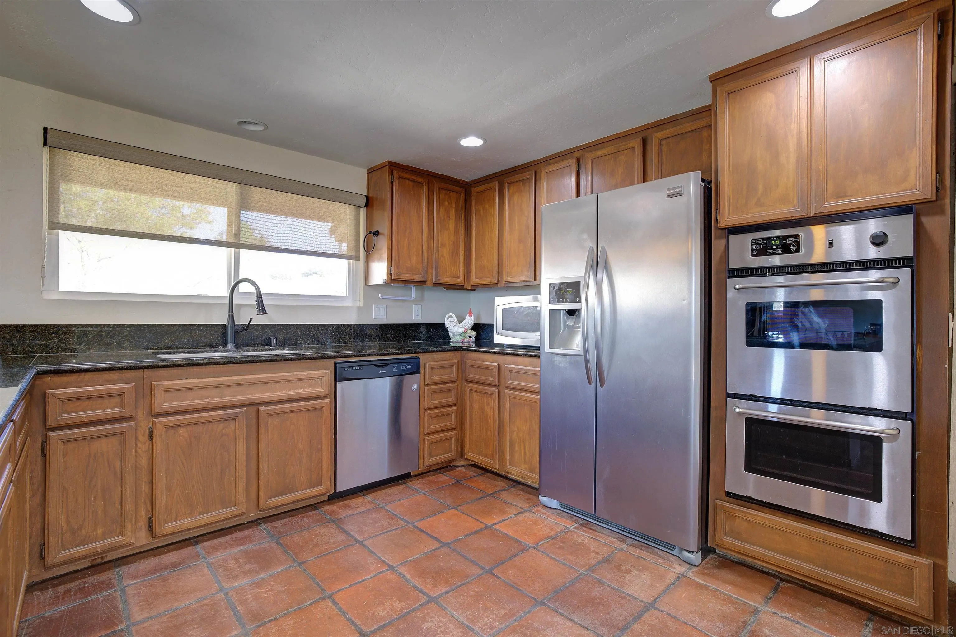 29489 Miller Road Valley Center, CA 92082 - Photo 5 of 30 a kitchen with stainless steel appliances granite countertop a refrigerator and a sink