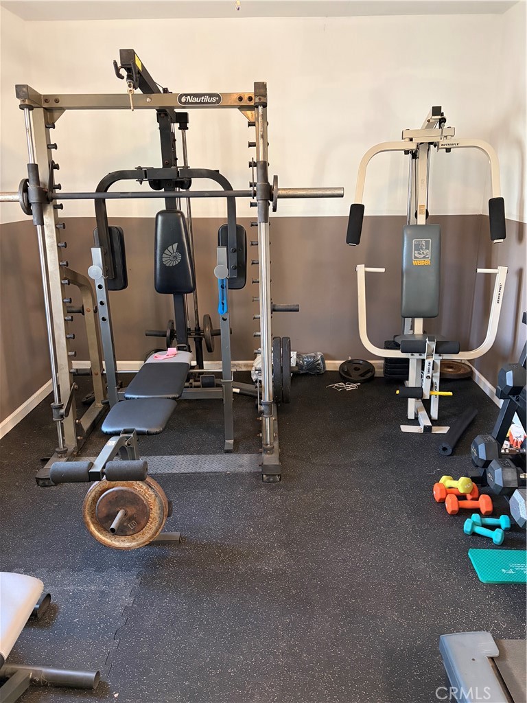 646 El Rancho Drive El Cajon, CA 92019 - Photo 15 of 23 a view of a room with gym equipment
