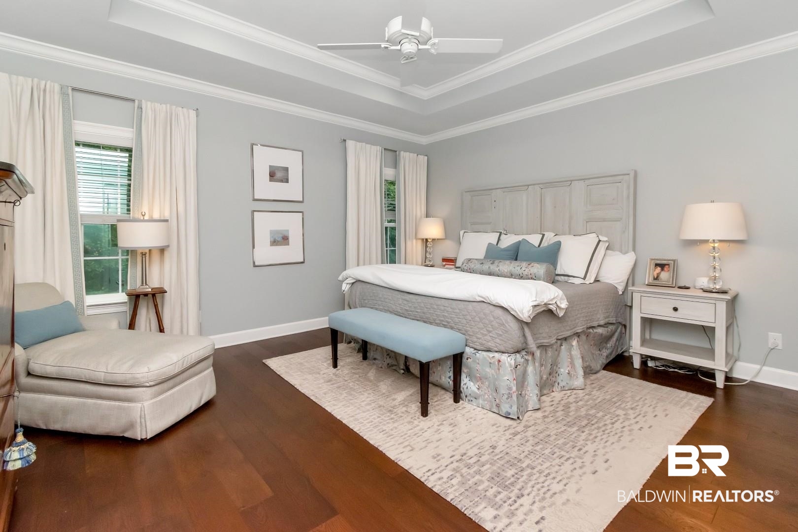 319 Springhill Woods Drive Mobile, AL 36608 - Photo 23 of 39 Bedroom featuring a tray ceiling, dark wood finished floors, ceiling fan, and crown molding