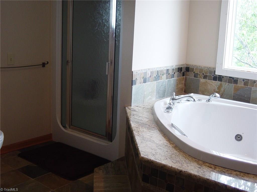 326 Cherokee Lane Purlear, NC 28665 - Photo 18 of 30 Bath in primary bedroom suite.