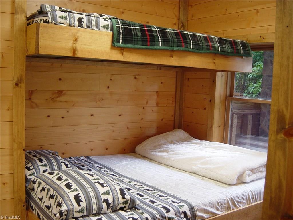 326 Cherokee Lane Purlear, NC 28665 - Photo 22 of 30 Lower level bedroom with built-in bunks.