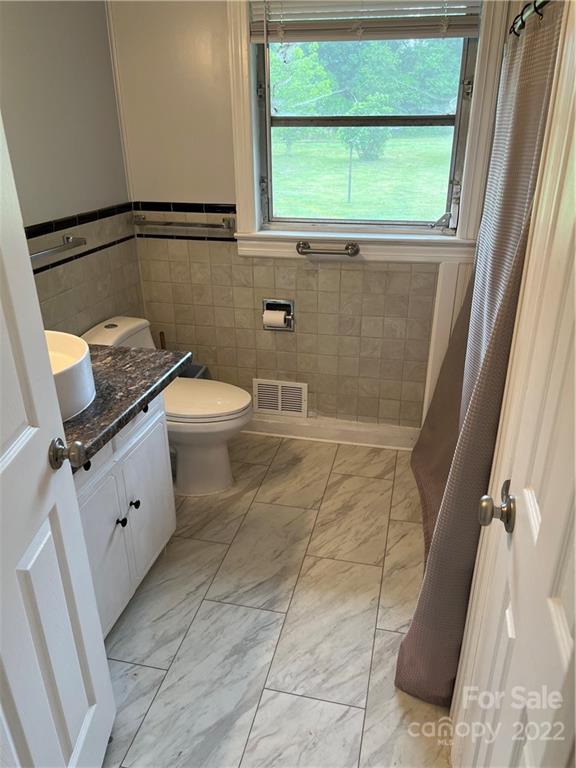 280 Stone Road, Unit 16 Salisbury, NC 28146 - Photo 13 of 25 a bathroom with a granite countertop sink toilet and shower