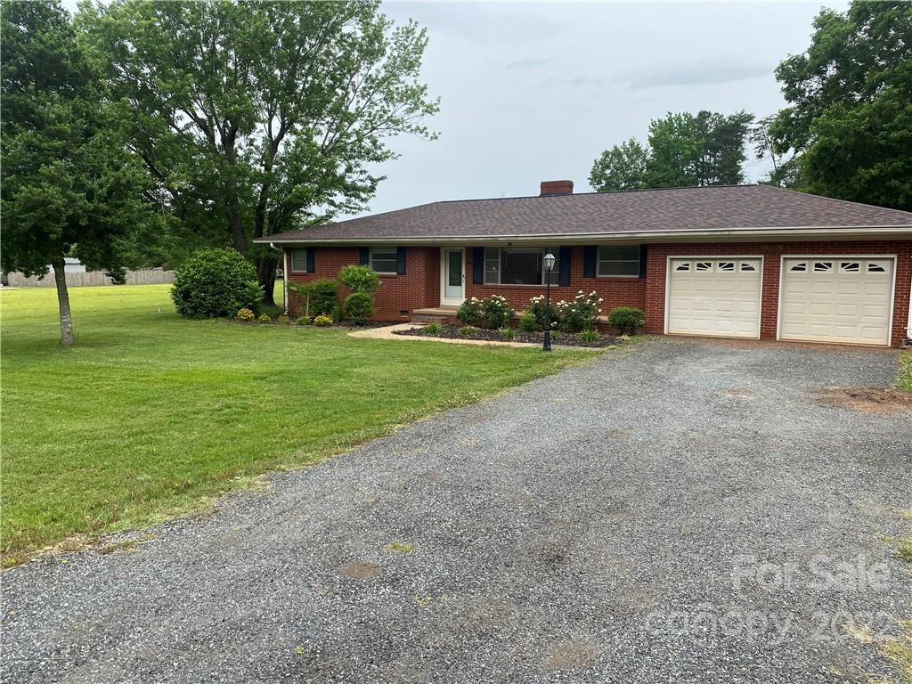 280 Stone Road, Unit 16 Salisbury, NC 28146 - Photo 2 of 25 a front view of a house with garden