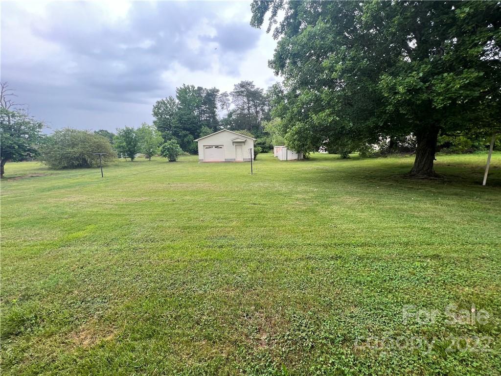 280 Stone Road, Unit 16 Salisbury, NC 28146 - Photo 23 of 25 a view of a field with trees in the background