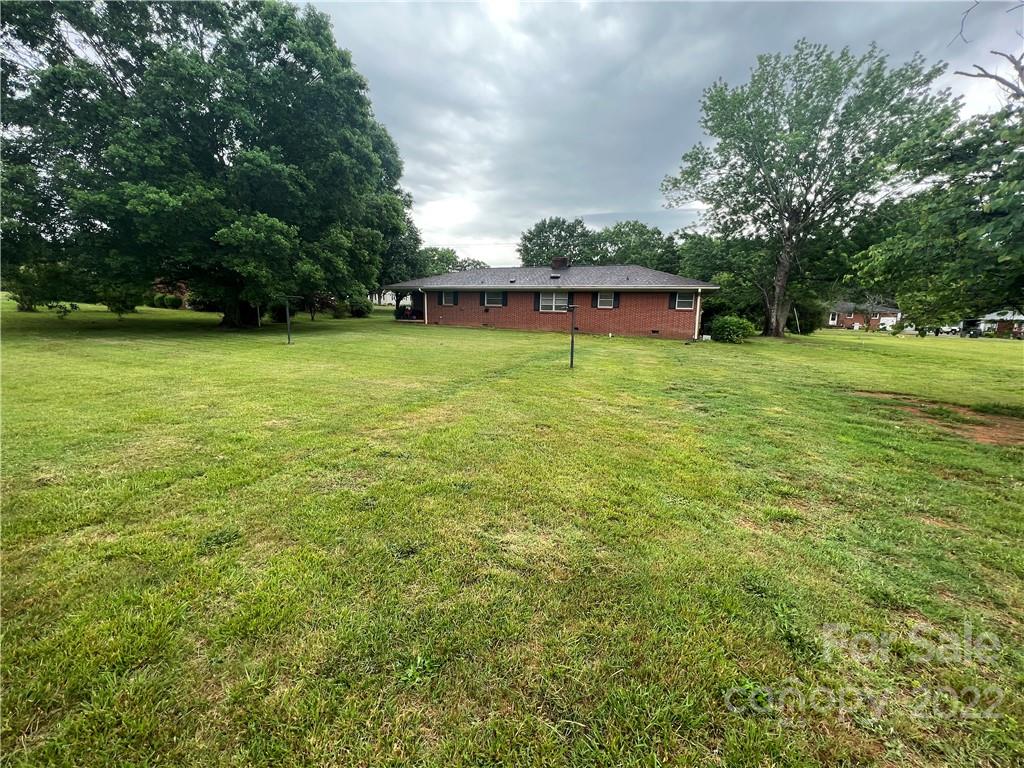 280 Stone Road, Unit 16 Salisbury, NC 28146 - Photo 25 of 25 a backyard of a house with lots of green space