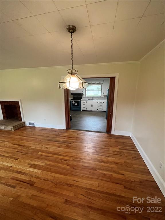 280 Stone Road, Unit 16 Salisbury, NC 28146 - Photo 7 of 25 a view of a livingroom with a ceiling fan and wooden floor