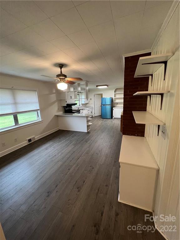 280 Stone Road, Unit 16 Salisbury, NC 28146 - Photo 10 of 25 a room with lots of wooden furniture and a window