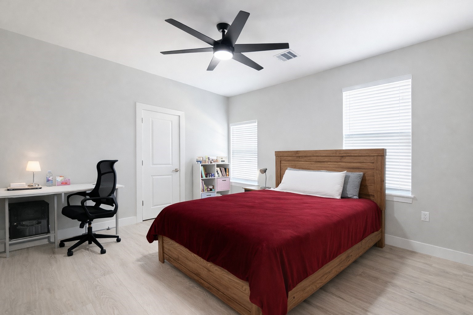 10115 Porto Rico Road Houston, TX 77041 - Photo 12 of 17 a bedroom with a bed a desk and chair with the potted plant