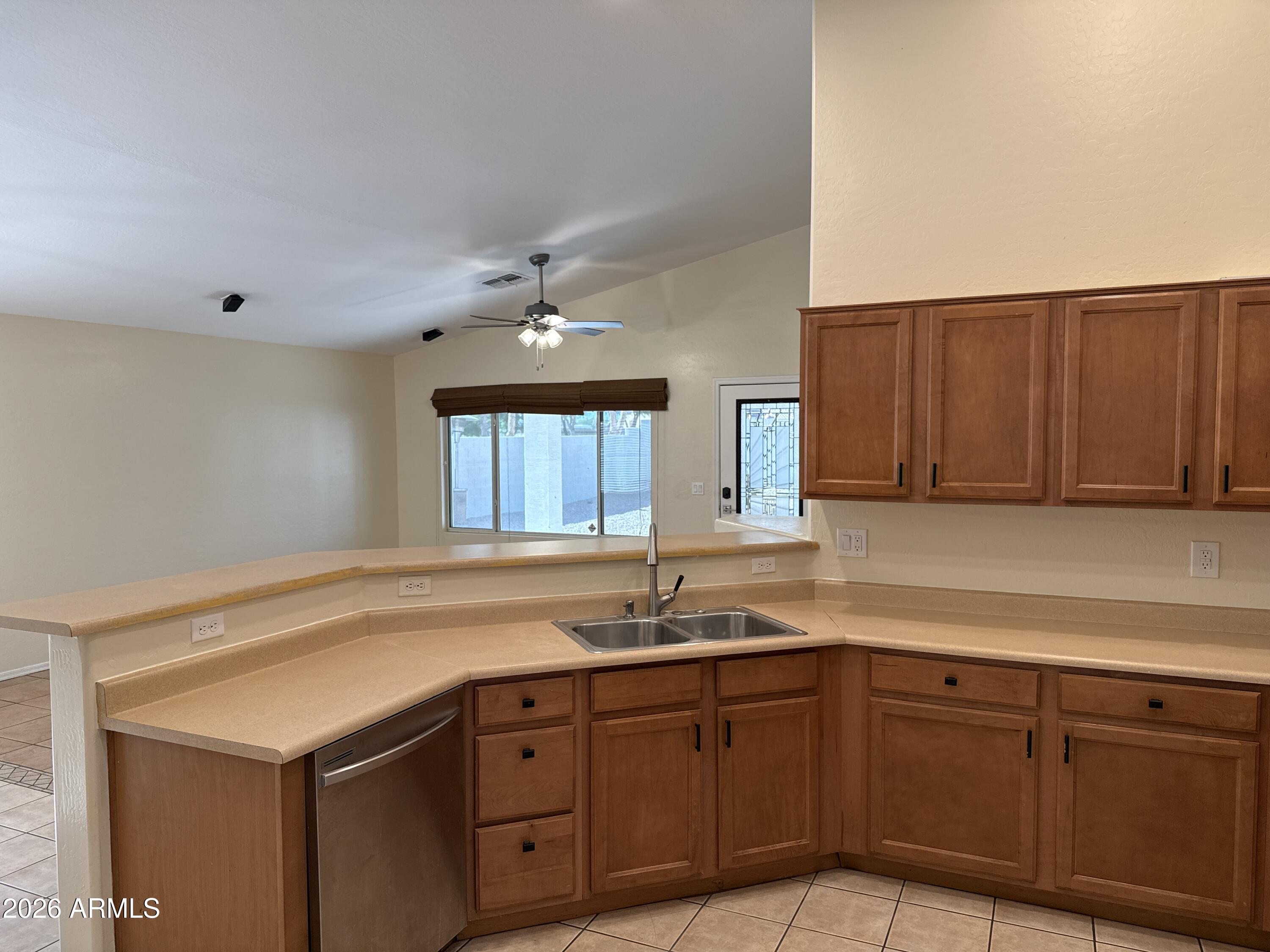 9630 West Reno View Drive Peoria, AZ 85345 - Photo 6 of 21 a kitchen with sink and cabinets