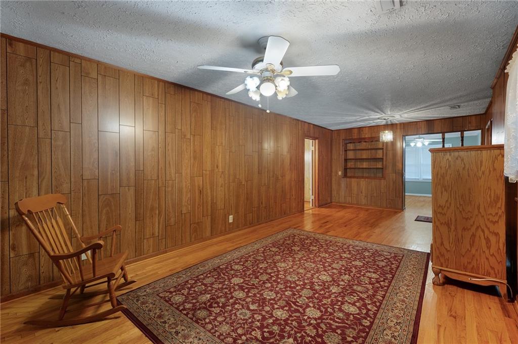 3293 Rome Road Southwest Plainville, GA 30733 - Photo 13 of 42 a view of a livingroom with furniture and wooden floor