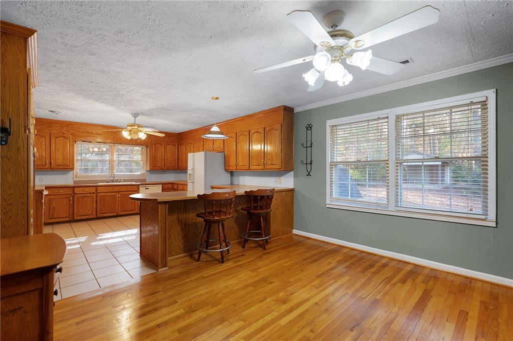 3293 Rome Road Southwest Plainville, GA 30733 - Photo 18 of 42 a view of a dining room with furniture window and wooden floor