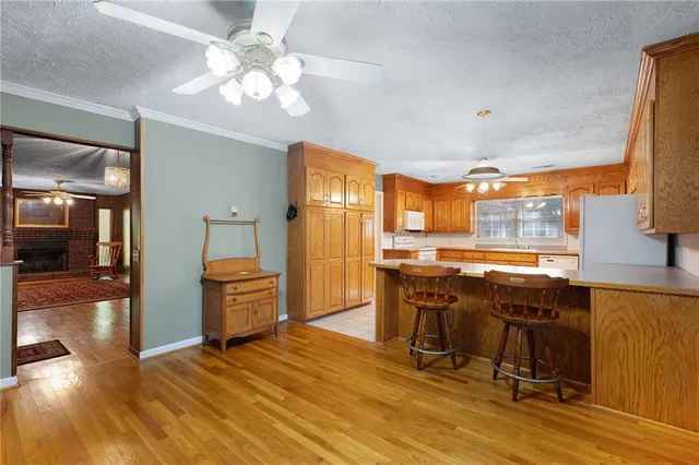 a kitchen with granite countertop sink cabinets and window