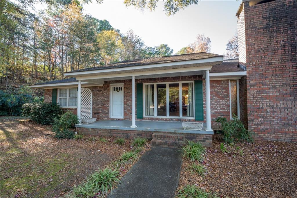 3293 Rome Road Southwest Plainville, GA 30733 - Photo 2 of 42 a front view of a house with garden