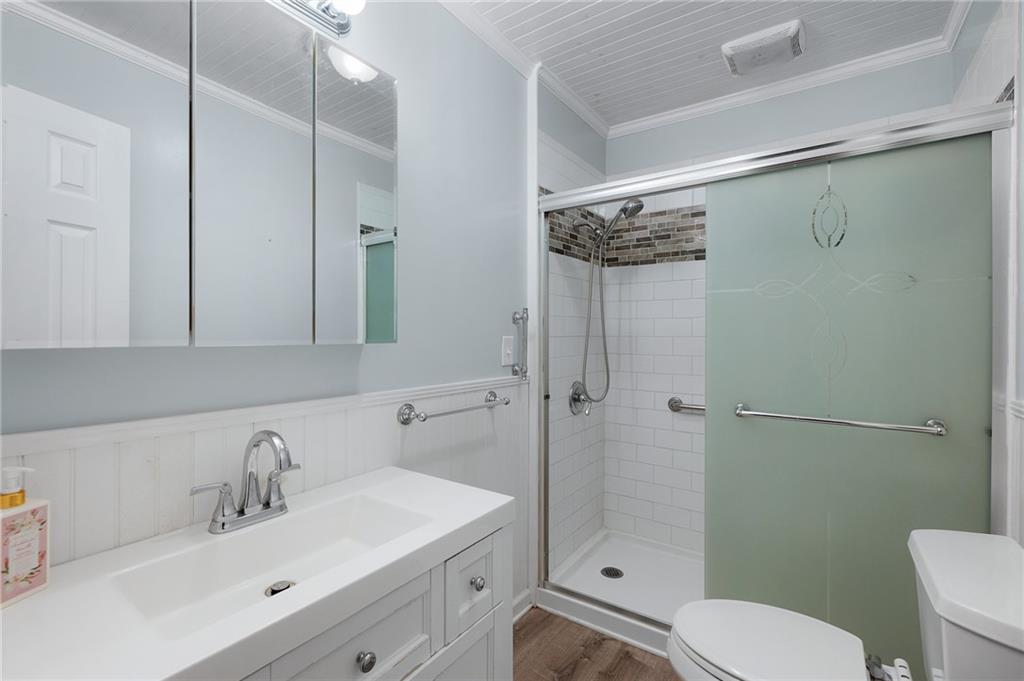 3293 Rome Road Southwest Plainville, GA 30733 - Photo 24 of 42 a bathroom with a sink a toilet and shower