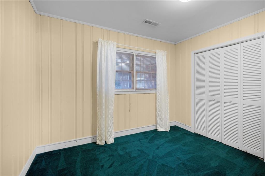 3293 Rome Road Southwest Plainville, GA 30733 - Photo 25 of 42 an empty room with a door