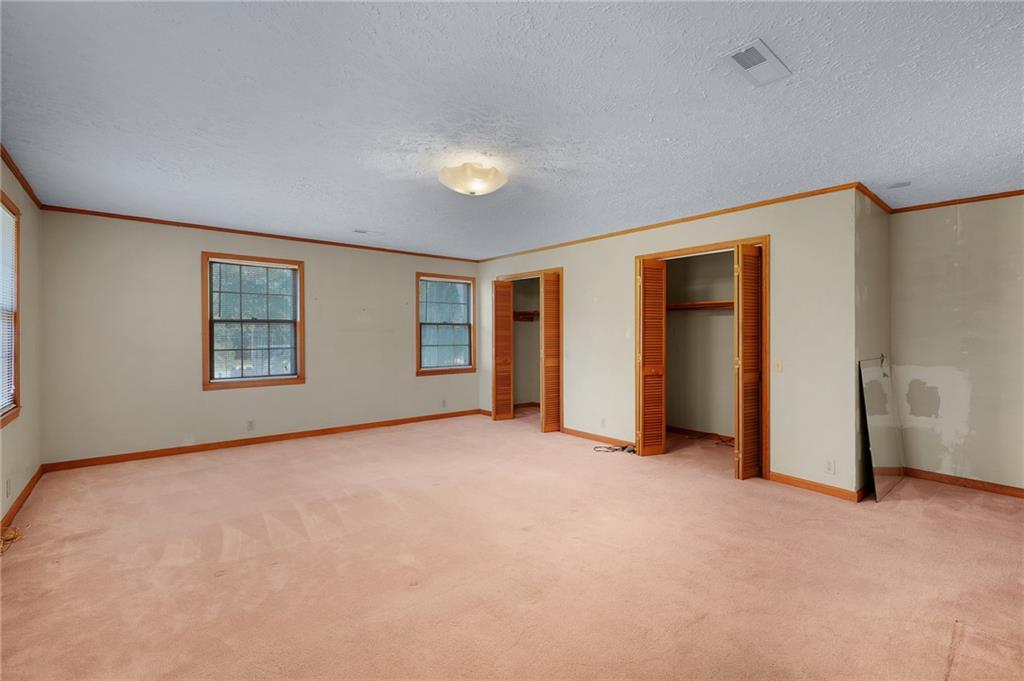 3293 Rome Road Southwest Plainville, GA 30733 - Photo 30 of 42 an empty room with windows and closet