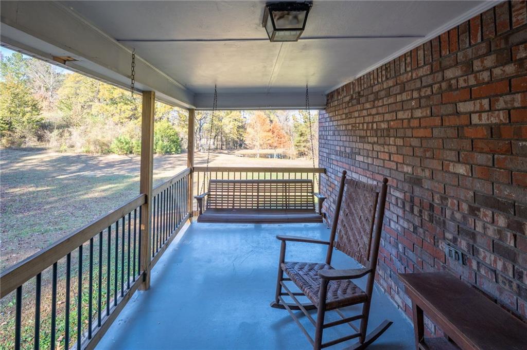 3293 Rome Road Southwest Plainville, GA 30733 - Photo 35 of 42 a view of a porch with furniture